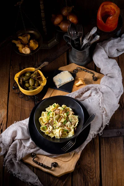 stock image Reginette noodles in cream sauce with fresh chanterelles and capers