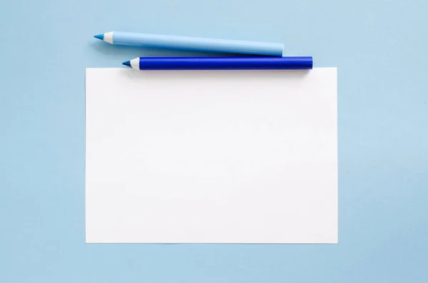 White Blank Sheet Paper Two Blue Pencils Mock Copy Space Stock Image