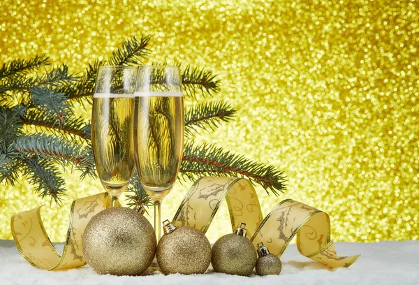 Two Wineglasses Champagne Christmas Decoranions Standing Snowy Surface Festive Gold — Stock Photo, Image