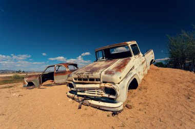 Abandoned cars in Solitaire, small settlement in the Khomas Region of central Namibia near the Namib-Naukluft National Park. Africa clipart