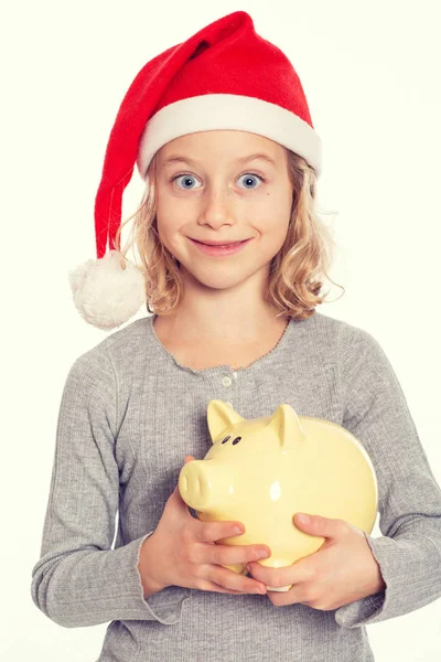 Nice Blond Girl Santa Cap Piggy Bank — Stockfoto