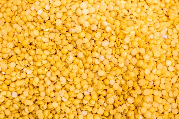 Organic food yellow lentils texture and background