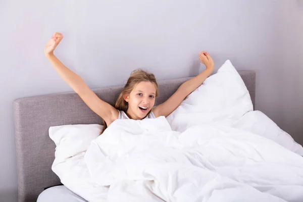 Portrait Girl Sitting Bed Stretching Her Arms Bedroom — Stock Photo, Image