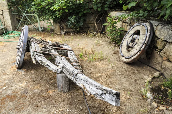 Traditional two-wheeler ox cart (or bullock cart) entirely made of timber in advanced state of disrepair, in Northern Portugal