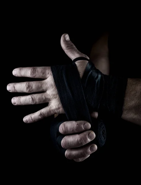 Man Wraps His Hands Black Textile Bandage Sports Black Background — Stock Photo, Image