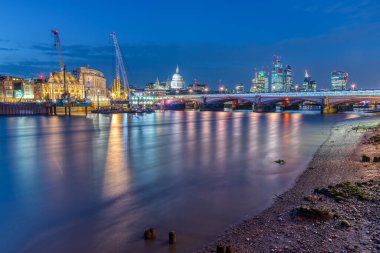The St Pauls cathedral, Blackfriars Bridge and the City of London at night clipart