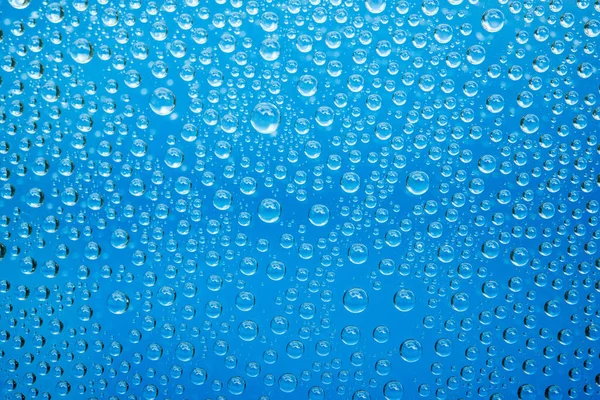 Gotas Agua Sobre Fondo Azul —  Fotos de Stock