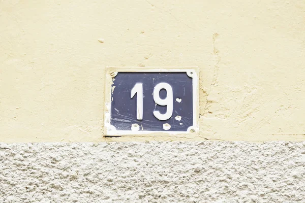 Nummer Negentien Een Muur Detail Van Een Muur Met Informatienummers — Stockfoto