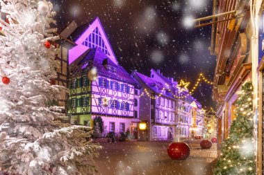Traditional Alsatian half-timbered houses in old town of Colmar, decorated and illuminated at christmas time, Alsace, France clipart