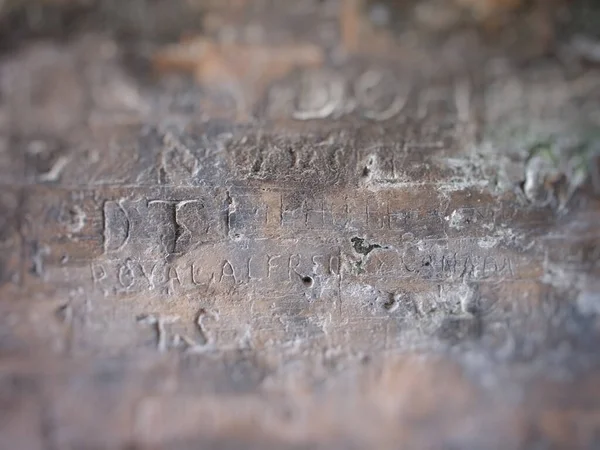 Gravierte Schriften Auf Steinmauer — Stockfoto