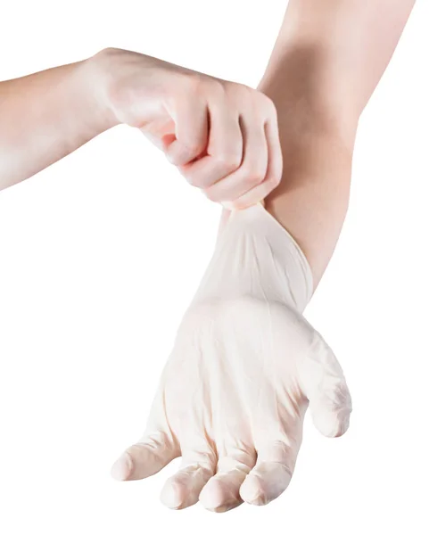 女性の手は白い背景に隔離された別の手にラテックス手袋を身に着けている — ストック写真
