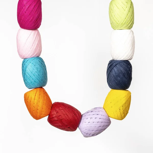 Some Colored Raffia Balls Hanging White Surface — Stock Photo, Image
