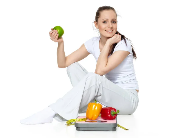 Sporty Young Woman Scales Fresh Peppers Apple White Background Concept — 图库照片