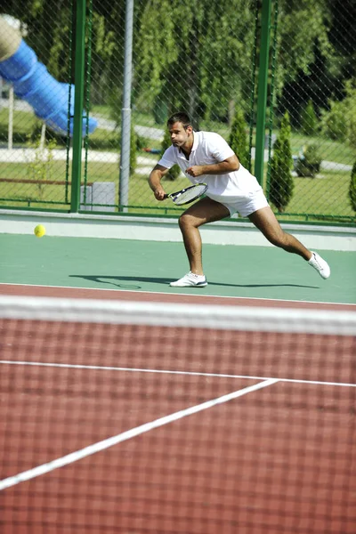 Young Man Play Tennis Outdoor Orange Tennis Court Early Morning Royalty Free Stock Photos