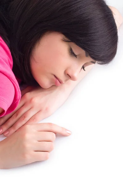 Adolescente Sdraiato Sul Pavimento Isolato Bianco — Foto Stock