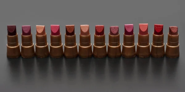 Small Tubeses Lipstick Dark Gray Background — Stock Photo, Image