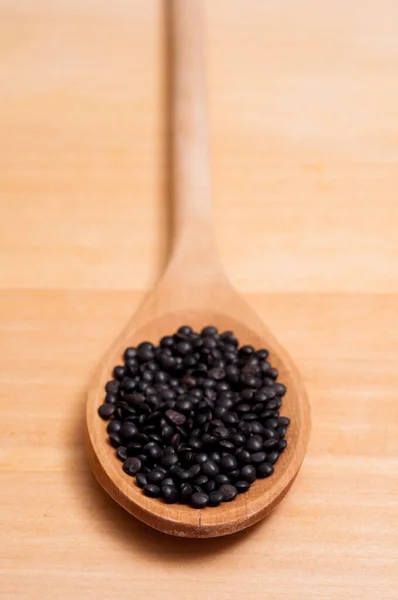 Close Wooden Spoon Black Beluga Lentils — Stock Photo, Image