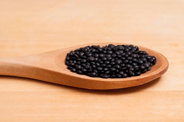 Close Black Lentils Wooden Spoon — Stock Photo, Image