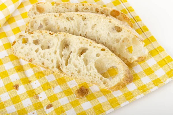 Drei Scheiben Ciabatta Brot Auf Einer Karierten Tischdecke — Stockfoto