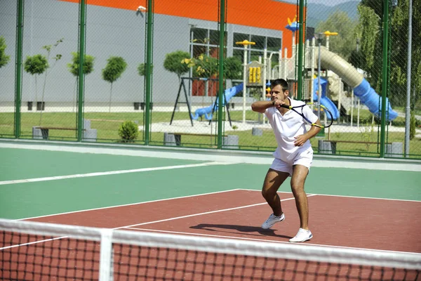 Young Man Play Tennis Outdoor Orange Tennis Court Early Morning Royalty Free Stock Images