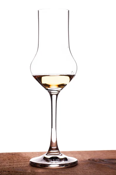Glass Grappa Stands Plank Wood Backlight — Stock Photo, Image