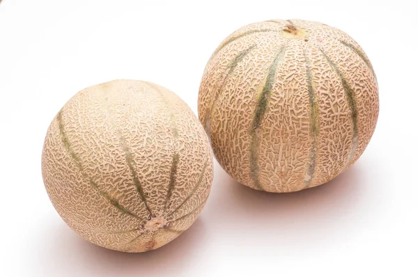 Dua Charentais Melon Pada Latar Belakang Putih — Stok Foto