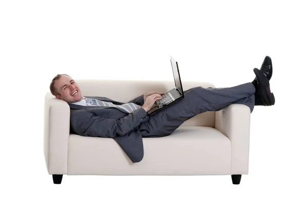 Businessman Lying Couch Laptop White Background Stock Photo