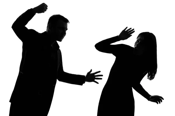 つの白人カップル男と女の白い背景で隔離のスタジオ シルエットで家庭内暴力を表現します — ストック写真