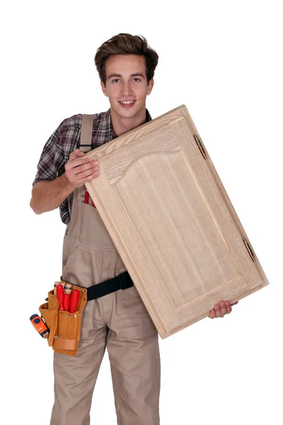 Young Carpenter Holding Cupboard Door — 스톡 사진