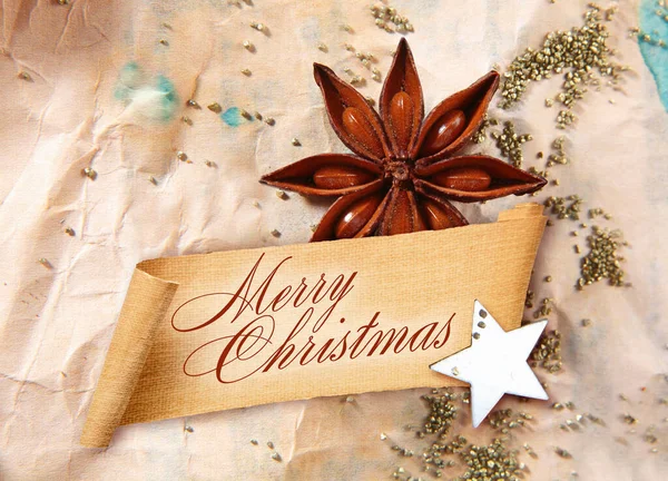 Merry Christmas Greeting Curled Banner Star Anise Spice Star Arranged — Stok Foto