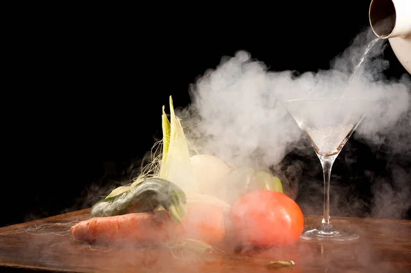 Still life of vegetables and liquid nitrogen