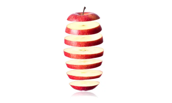 苹果片漂浮在白色背景的前面 — 图库照片