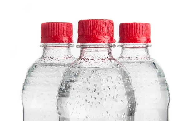 Plastikflaschen Mit Trinkwasser Isoliert Auf Weiß — Stockfoto