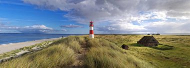 scenics with lighthouse on sylt clipart