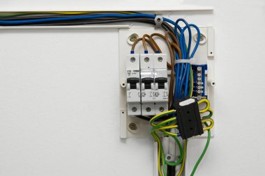 Electric wiring and fusebox in a house clipart