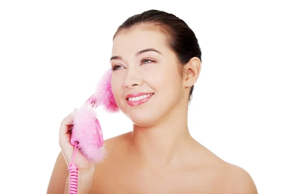 电话里快乐的女人 被白色隔离的女人 免版税图库照片