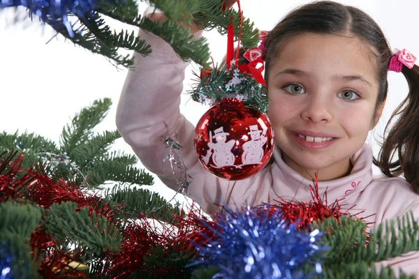 Schoolgirl Decorated Christmas Tree Royalty Free Stock Images