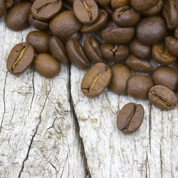 Kaffeebohnen Auf Altem Holzgrund — Stockfoto