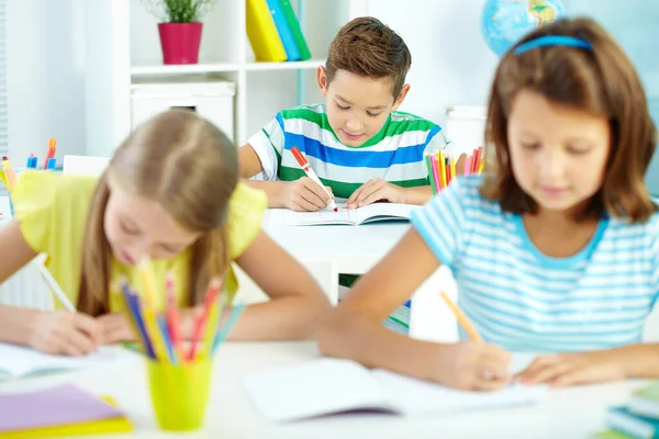 Cute Schoolboy Drawing Workplace Schoolmates Foreground — Stock Photo, Image