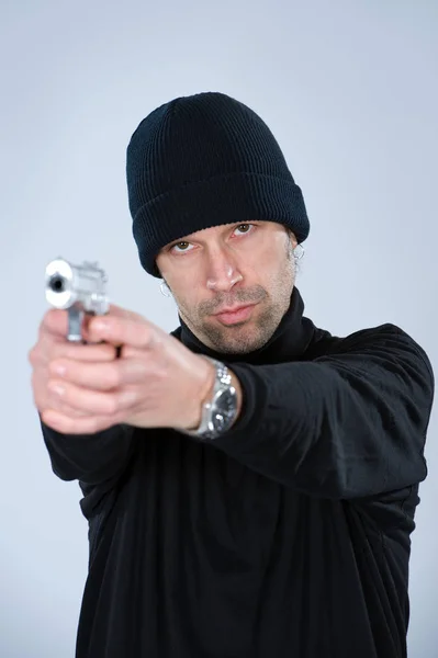 Young Man Black Cap Holding Gun — Stock Photo, Image