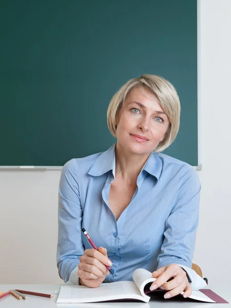 Teacher Sitting Desk Classroom Stock Image