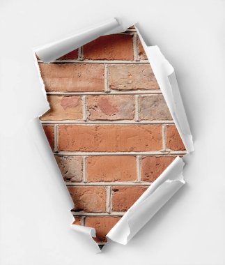Hole ripped paper. Brick wall background. clipart