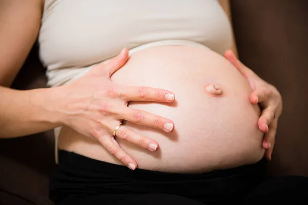 Detail Hands Holding Pregnant Belly Indoors — Stock Photo, Image