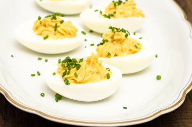 stuffed mimosa eggs with chives clipart