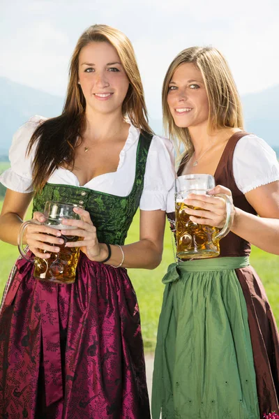 Two Women Dirndl Holding Beer Mugs Front Oktoberfest — Stock Photo, Image