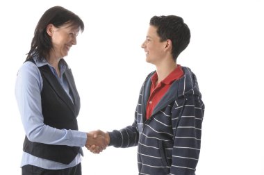an adult woman shakes her juvenile son's hand in front of white background. clipart