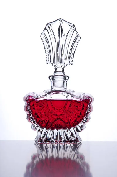 Noble Perfume Bottle Red Liquid Reflection Front White Background — Stock fotografie