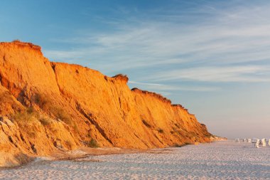 red cliff in kampen on sylt in the north sea in the evening light ....... red cliff (red cliff) near kampen on sylt at the north sea,schleswig-holstein,germany in evenig light. clipart