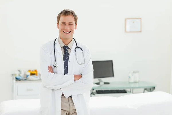 Smiling Doctor His Arms Folded His Examination Room — Foto de Stock