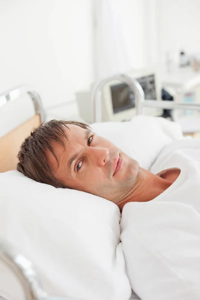 Serious Patient Looking Camera While Lying Hospital Bed — Stock Photo, Image